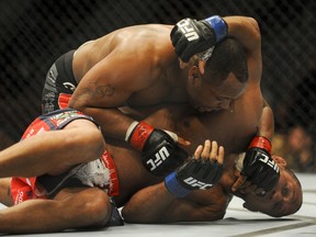 Daniel Cormier pins Dan Henderson to the mat during their UFC 173 welterweight bout at MGM Grand Garden Arena. Cormeir won his bout by way of submission on May 24, 2014. (Stephen R. Sylvanie/USA TODAY Sports)