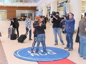 The James Armstrong Richardson International Airport's Hug Rug has been making happy reunions even happier for a full year now.