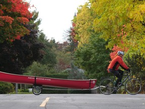 A man rides his canoe down Pleasant Park in Ottawa Friday Oct 10,  2014. Fantastic weather is expected for the upcoming Thanksgiving weekend in Ottawa.   Tony Caldwell/Ottawa Sun/QMI Agency
