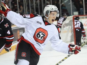 Ottawa 67's Dante Salituro celebrates his hat trick, and game winning goal, against the  Niagara IceDogs during OHL hockey action at TD Place on Friday October 10, 2014. Errol McGihon/Ottawa Sun/QMI Agency