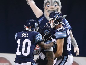 The Argos celebrate the winning touchdown against the Hamilton Tiger-Cats on Oct. 10. (Veronica Henri, Toronto Sun)