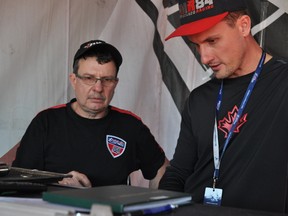 Canadian pilot Pete McLeod (right) studies data with McLeod Racing lead technician Patrick Phillips at Las Vegas Motor Speedway in Las Vegas October 10, 2014. CHRIS MONTANINI\LONDONER\QMI AGENCY