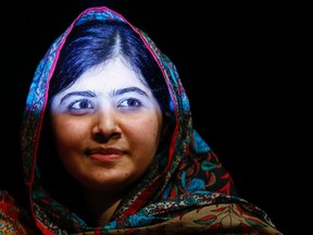 Pakistani schoolgirl Malala Yousafzai, the joint winner of the Nobel Peace Prize, leaves after speaking at Birmingham library in Birmingham, central England October 10, 2014. Pakistani teenager Yousafzai, who was shot in the head by the Taliban in 2012 for advocating girls' right to education, and Indian campaigner against child trafficking and labour Kailash Satyarthi won the 2014 Nobel Peace Prize on Friday. REUTERS/Darren Staples