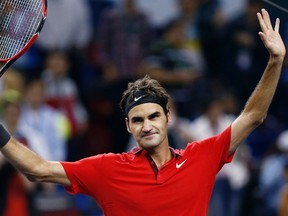 Roger Federer of Switzerland celebrates winning his men's singles semi-final match against Novak Djokovic of Serbia at the Shanghai Masters tennis tournament in Shanghai October 11, 2014. (REUTERS/Aly Song)