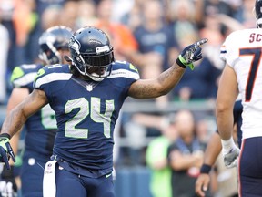 Seattle Seahawks running back Marshawn Lynch (24) celebrates a touchdown run against the Chicago Bears during the first quarter at CenturyLink Field on Aug 22, 2014 in Seattle, WA, USA. (Joe Nicholson/USA TODAY Sports)