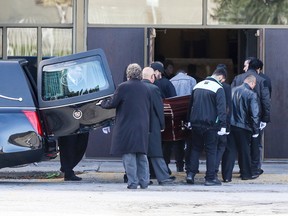 Pallbearers carry the casket of Michael Menjivar into St. Augustine of Canterbury Parish on Shoreham Dr. on Saturday, Oct. 11, 2014. (DAVE THOMAS/Toronto Sun)