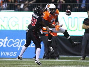 B.C Lions wide receiver Ernest Jackson (9) catches a pass against Ottawa Redblacks defensive back Brandyn Thompson (25) during the first half of their CFL football game in Vancouver, British Columbia, October 11, 2014. REUTERS/Ben Nelms