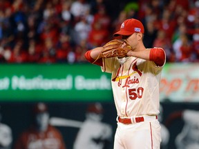St. Louis Cardinals starting pitcher Adam Wainwright prepares to throw against the San Francisco Giants in Game 1 of the National League Championship Series at Busch Stadium in St. Louis, Oct. 11, 2014. (JEFF CURRY/USA Today)