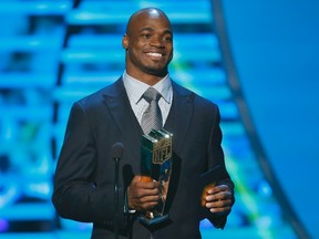 Minnesota Vikings running back Adrian Peterson accepts the NFL MVP award during the NFL Honors awards show in New Orleans, Louisiana in this February 2, 2013, file photo. (REUTERS)