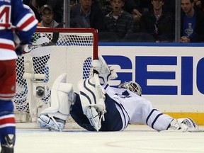 Maple Leafs goaltender James Reimer is injured in the third period against the New York Rangers in New York City on Sunday night. Reimer left the game. (AFP/PHOTO)