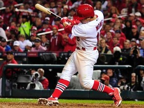 St. Louis Cardinals second baseman Kolten Wong hits the game-winning solo home run against the San Francisco Giants during the 9th inning in game two of the 2014 NLCS playoff baseball game at Busch Stadium, Oct 12, 2014. (Jeff Curry-USA TODAY Sports)