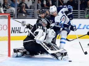Martin Jones of the Los Angeles Kings makes a save on Blake Wheeler of the Winnipeg Jets during the first period at Staples Center on October 12, 2014 in Los Angeles, California.  (Harry How/Getty Images/AFP)