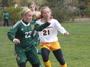 Cambrian Golden Shield's Courtney Ceccarelli (right) battles for the ball against Durham's Madison Smethurst during an OCAA playoff game at the Cambrian pitch Saturday.