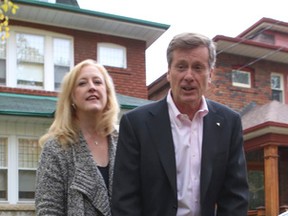 Transport Minister Lisa Raitt and Mayoral candidate John Tory. (DAVE THOMAS, Toronto Sun)