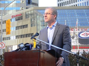 Mayoral candidate Gord Steeves stands in front on Winnipeg's Portage and Main at a press conference, Monday, Oct. 13, 2014. Steeves pledged if he becomes mayor that he would not open the Portage Avenue and Main Street intersection to pedestrian traffic. (GLEN DAWKINS/Winnipeg Sun/QMI Agency)