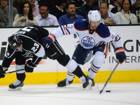 Oilers defenceman Jeff Petry battles Kings forward Dustin Brown for the puck during a game at the Staples Centre in Los Angeles last season. (USA TODAY)