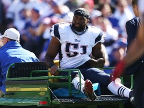 Jerod Mayo of the New England Patriots is carted off the field after an injury against the Buffalo Bills during the first half at Ralph Wilson Stadium on October 12, 2014. (Tom Szczerbowski/Getty Images/AFP)