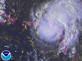 Gonzalo is seen over the Caribbean Ocean in this NOAA satellite image taken at 16:15EDT (20:15GMT)  October 13, 2014.   REUTERS/NOAA/Handout