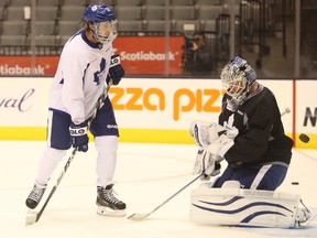 Maple Leafs winger David Clarkson tips shots during practice on Monday. (Jack Boland/Toronto Sun)
