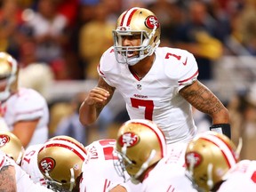 Colin Kaepernick of the San Francisco 49ers calls a play in the first quarter against the St. Louis Rams at Edward Jones Dome on October 13, 2014. (Dilip Vishwanat/Getty Images/AFP)