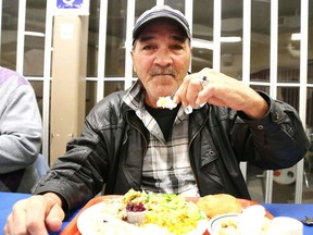 Gino Donato/The Sudbury Star    
Andy Leclair enjoys his Thanksgiving Day meal at the Elgin Street Mission on Monday.