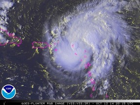 Tropical Storm Gonzalo is seen over the Caribbean Ocean in this NOAA satellite image taken at 16:15EDT (20:15GMT)  October 13, 2014. (REUTERS/NOAA/Handout)