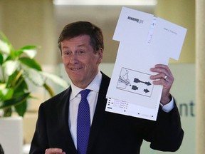Mayoral candidate John Tory votes in advance poll at City Hall on Tuesday Oct. 14, 2014. (CRAIG ROBERTSON/Toronto Sun)