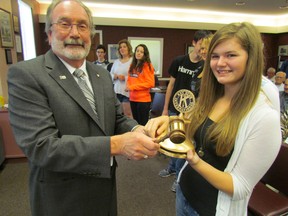 John Button, president of Kiwanis International, presents a club bell and gavel Tuesday in Sarnia to Reena Herbstreit, president of the Kiwanis Key Club at Sarnia Collegiate Institute and Technical School. Button, who is from Ridgetown, was speaking at a meeting of the Sarnia-Lambton Golden K Kiwanis Club. PAUL MORDEN/THE OBSERVER/QMI AGENCY