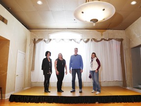 Starting late February 2015, The Village Theatre, founded by Mike and Sarah Kirby, right, will feature three dinner theatre nights in the Ritchie Room at Capers Restaurant, above, in downtown Belleville, Ont. Along with the Kirbys, are Capers' general managers Melanie Hilmi, left and Katie Schick. (Thursday, Oct. 9, 2014). - JEROME LESSARD/THE INTELLIGENCER/QMI AGENCY