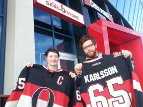 Nadia Telford, 23, and Dave Lahaise, 24, were some of the first fans in line at the Canadian Tire Centre Sens Store Tuesday to have the 'C' stitched onto their Erik Karlsson No. 65 jerseys. AEDAN HELMER / OTTAWA SUN