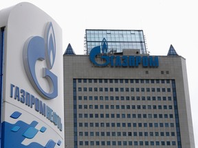 A general view shows the headquarters of Gazprom, with a board of Gazprom Neft, the oil arm of Gazprom seen in the foreground, on the day of the annual general meeting of the company's shareholders in Moscow, June 27, 2014. (REUTERS/Sergei Karpukhin)