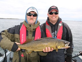 Paul Zuzock, left, and Nicholas Werner hold a walleye that weighed 12 pounds, 4 ounces. (Supplied photo)
