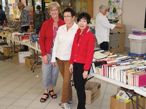 Alice Cook, Dale Ferguson and Carol Haavardsrud during their shift running the Friends of the Library biannual used book sale on Wednesday, October 8. John Stoesser photos/QMI Agency