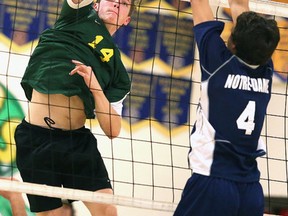 Lockerby's  Willem Deisinger goes up for a smash during senior boys vollebyall action against Notre Dame at Lockerby on Tuesday evening.