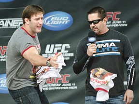 Mike Goldberg (right), seen here prior to UFC 131 in Vancouver three years ago, is being pulled from FOX's NFL coverage after calling his first game last week. (Carmine Marinelli/QMI Agency/Files)
