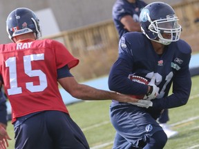 Toronto Argos QB Ricky Ray hands off to Anthony Woodson at practice on Oct. 14. (Dave Thomas, Toronto Sun)