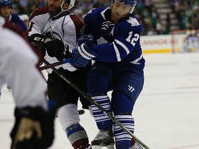 Maple Leafs defenceman Stephane Robidas (right) hits Maxime Talbot of the Colorado Avalanche during a National Hockey League game at the Air Canada Centre in Toronto on Oct. 14, 2014. (MICHAEL PEAKE/Toronto Sun)