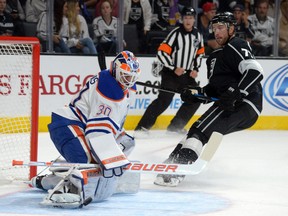 Oilers goaltender Ben Scrivens stops a shot by Kings forward Jeff Carter during second-period action Tuesday, Oct. 14,  at the Staples Centre in Los Angeles. The Oilers lost 6-1. (USA TODAY)