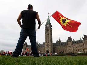 A First Nations protester takes part in the "National Day of Resistance" protest on Parliament Hill in Ottawa in this May 14, 2014 file photo. (REUTERS/Chris Wattie)