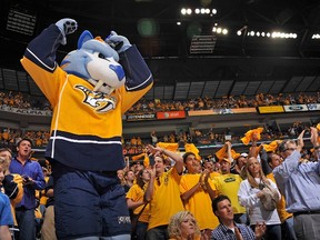 Team mascot Gnash tries to get Nashville Predators fans cheering against the Phoenix Coyotes in Game 4 of the Western Conference semifinals during the 2014 NHL Stanley Cup Playoffs at the Bridgestone Arena on May 2, 2012 in Nashville, Tennessee.   (Frederick Breedon/Getty Images/AFP)