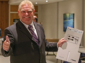 Mayoral candidate Doug Ford cast his ballot at an advance polling station in Etobicoke on Tuesday, Oct. 15, 2014. (DAVE THOMAS/Toronto Sun)