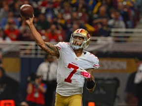Niners QB Colin Kaepernick had his $11,025 fine for inappropriate language cut in half by the league, even though there was no evidence of a racial slur. (Jeff Curry/USA TODAY Sports)