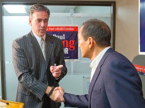Roger Caranci shakes hands with Paul Cheng after announcing he is stepping down from his mayoral race and throwing his support behind Cheng at a press conference at Cheng's Wellington Road campaign headquarters in London on Tuesday October 14, 2014.
(CRAIG GLOVER, The London Free Press)