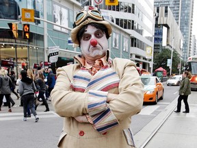 Toronto mayoral candidate Sketchy the Clown ispounds the pavement at Dundas Square on Oct. 15, 2014. (Craig Robertson/Toronto Sun)