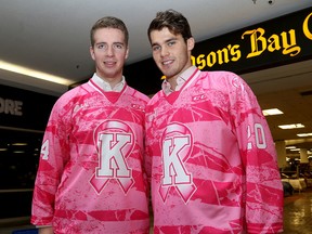 Kingston Frontenacs Evan McEneny, left, and Roland McKeown model pink jerseys at the Cataraqui Centre in Kingston on Wednesday. (Ian MacAlpine/The Whig-Standard)