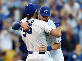 Kansas City Royals infielders Eric Hosmer and Mike Moustakas celebrate after defeating the Baltimore Orioles in Game 4 of the 2014 ALCS at Kauffman Stadium on October 15, 2014. (Peter G. Aiken/USA TODAY Sports)