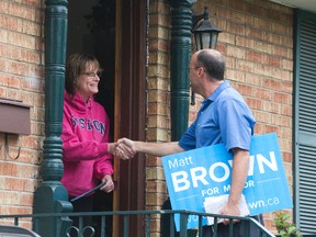 Mayoral candidate Matt Brown meets Valerie Momney while campaigning in the east end of  London, Ontario on Monday, October 13, 2014.  (DEREK RUTTAN, The London Free Press)
