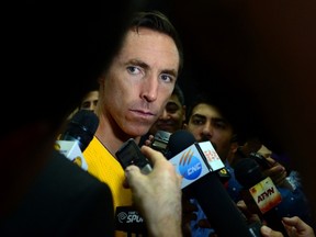 Steve Nash of the Los Angeles Lakers takes questions while surrounded by the press on media day in El Segundo, California on September 29, 2014. (AFP PHOTO/Frederic J. BROWN)