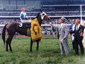 Legendary Maple Leafs owner Conn Smythe greets Jammed Lovely after the filly won the Queen's Plate in 1967.