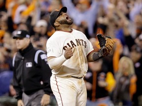 Pablo Sandoval of the San Francisco Giants celebrates after the Giants defeat the St. Louis Cardinals 6-4 in Game 4 of the National League Championship Series at AT&T Park on October 15, 2014. (Ezra Shaw/Getty Images/AFP)
